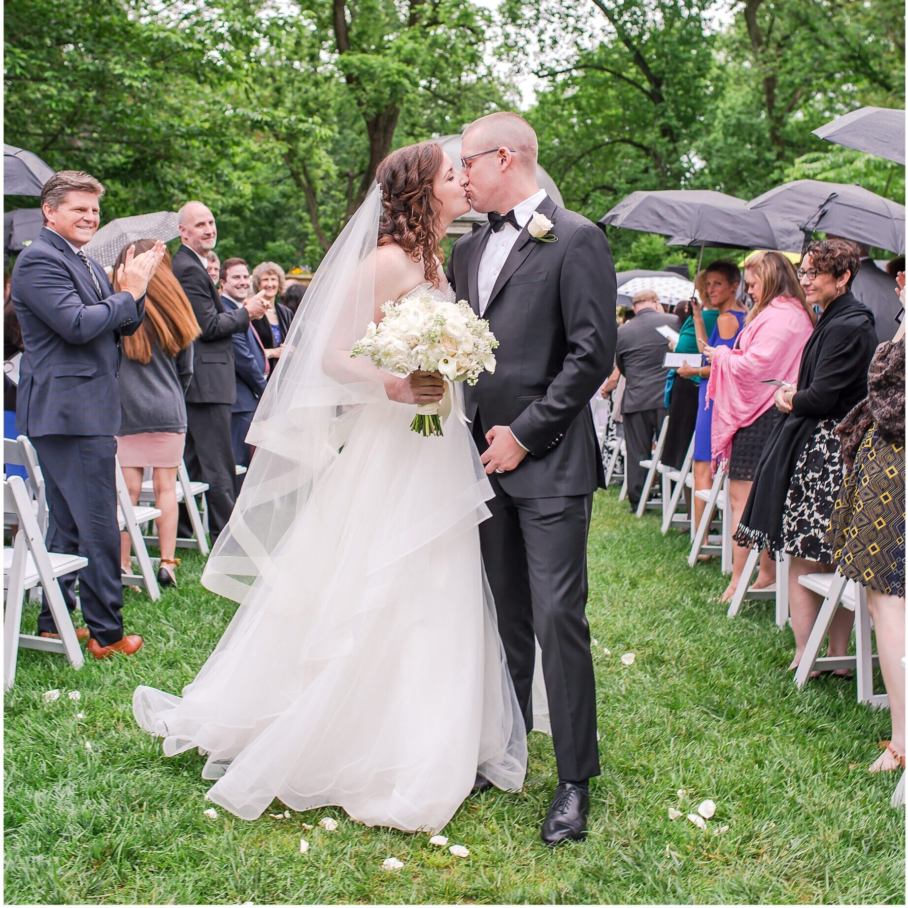 rain-wedding-outside-just-married-kiss