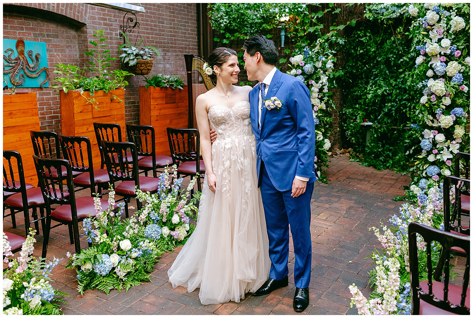 Bride and Groom Kissing Photo at the Wedding Ceremony Venue