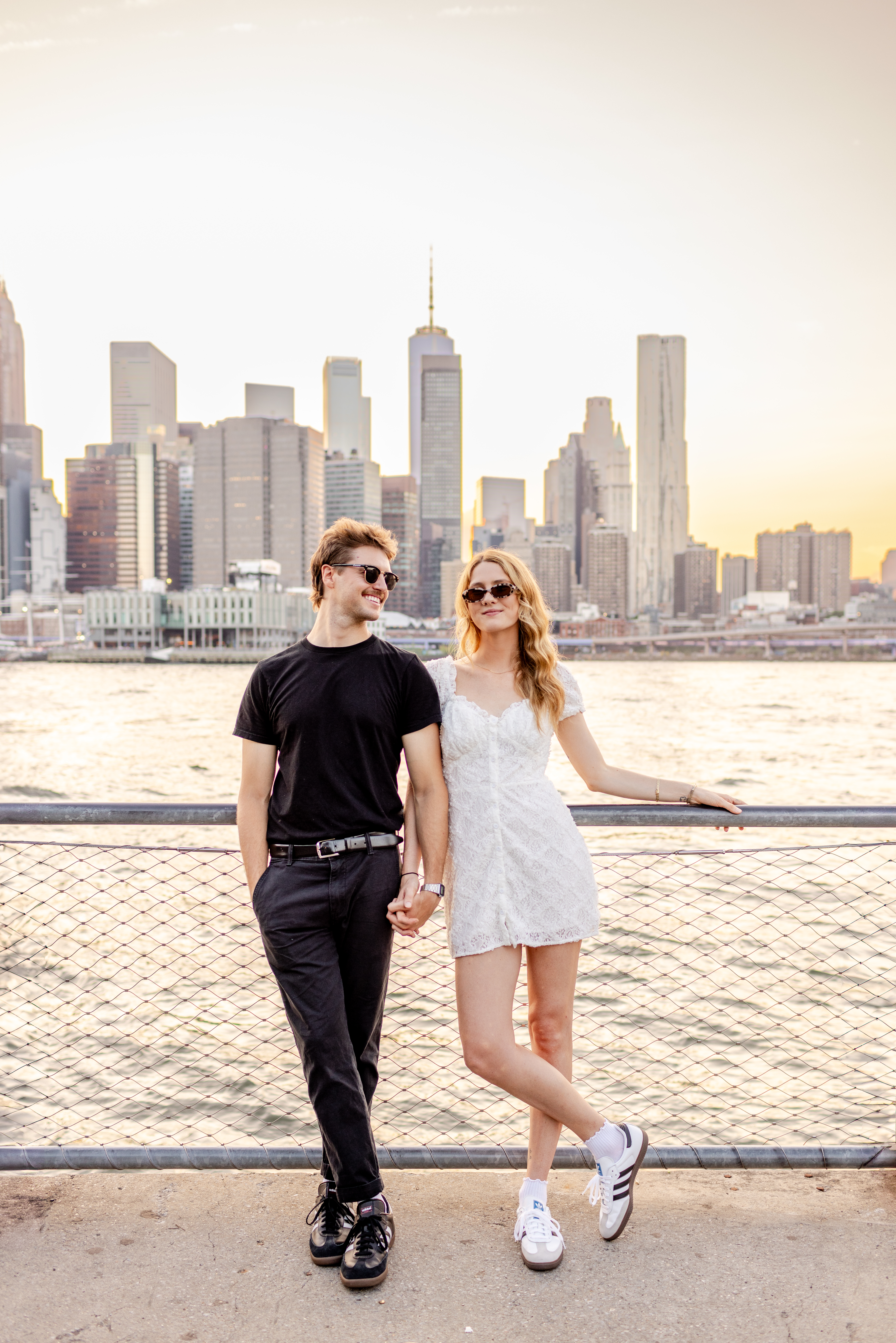 photo of brooklyn, new york city couple posing in brooklyn bridge park for their engagement photos