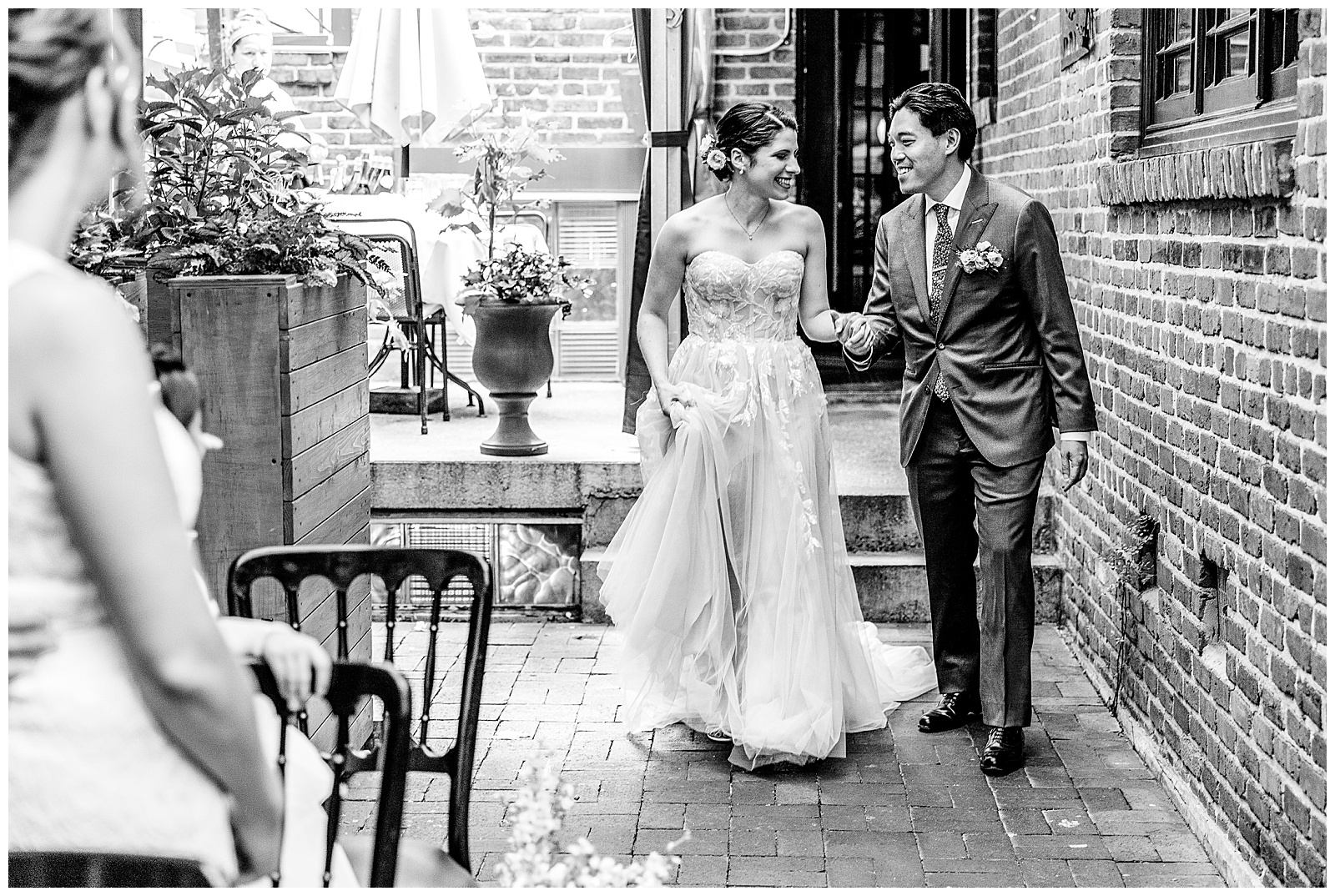 Bride and groom walk down the aisle together