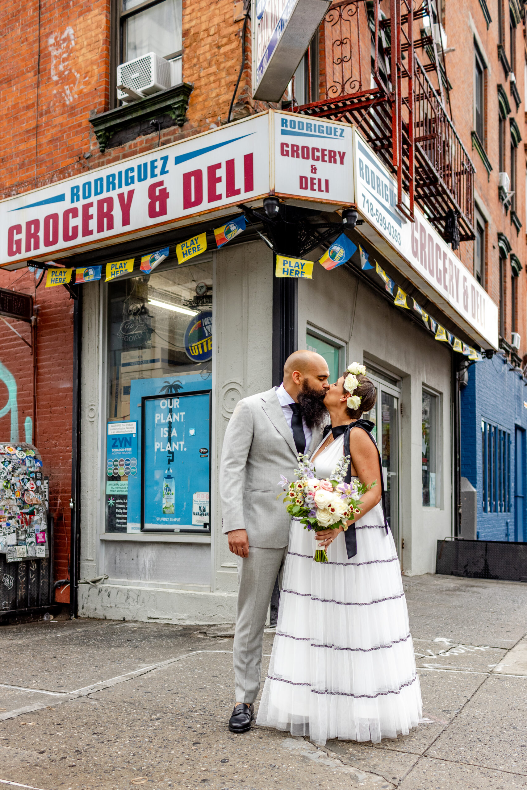 Bodega Bride and Groom kiss in Williamsburg Brooklyn on their wedding day