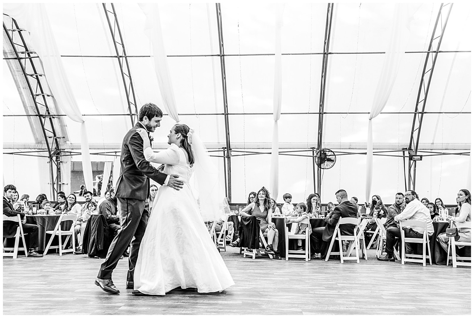 black and white portrait of bride and groom dancing on dance floor at their wedding reception at Romantic Autumn Wedding at Fairwinds