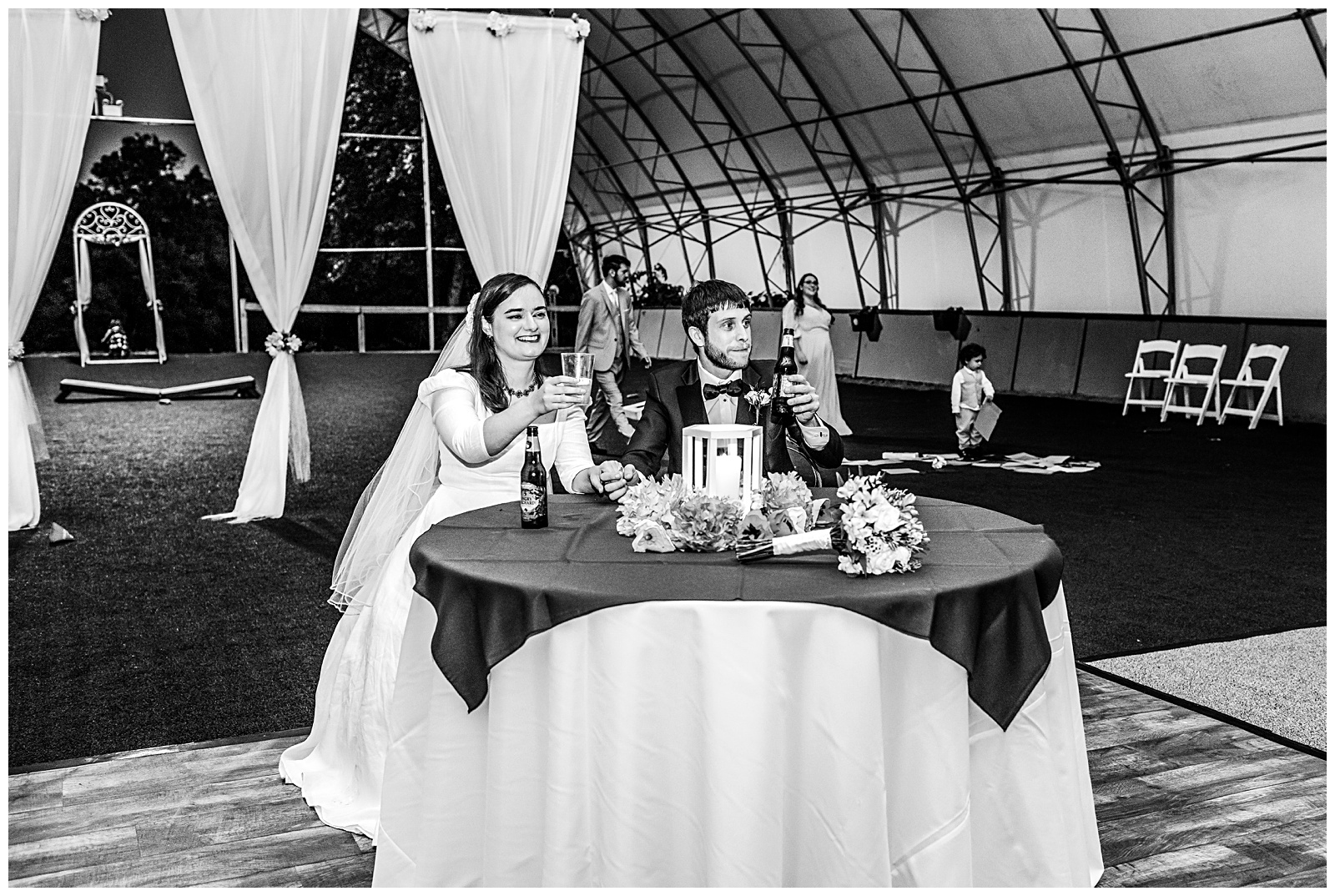 wedding reception toasts make the bride and groom raise their glasses at Romantic Autumn Wedding at Fairwinds