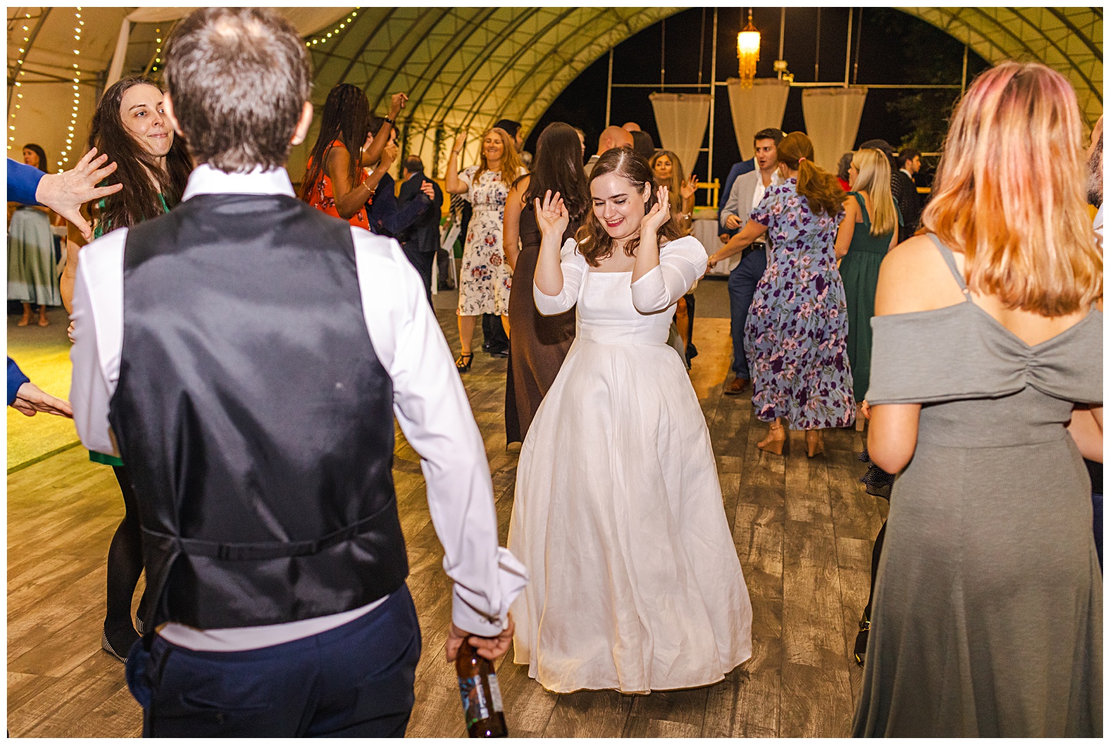 bride dancing on the dance floor while dj plays music and songs at the wedding reception at Romantic Autumn Wedding at Fairwinds