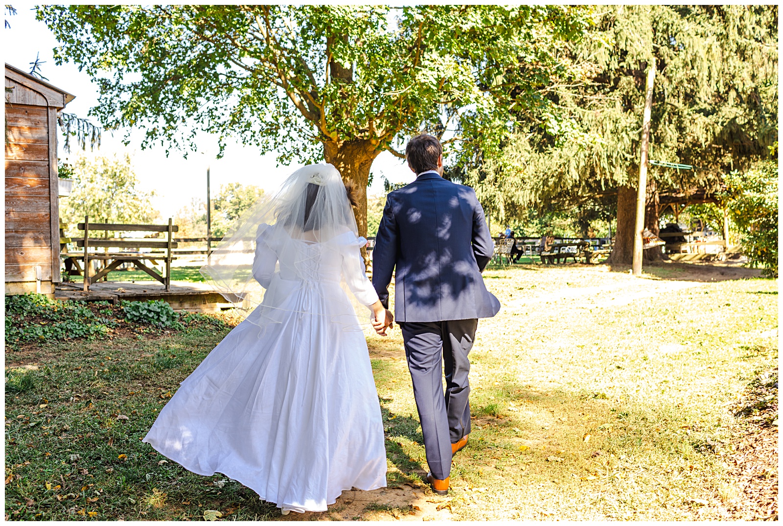 candid walking photo of bride and groom