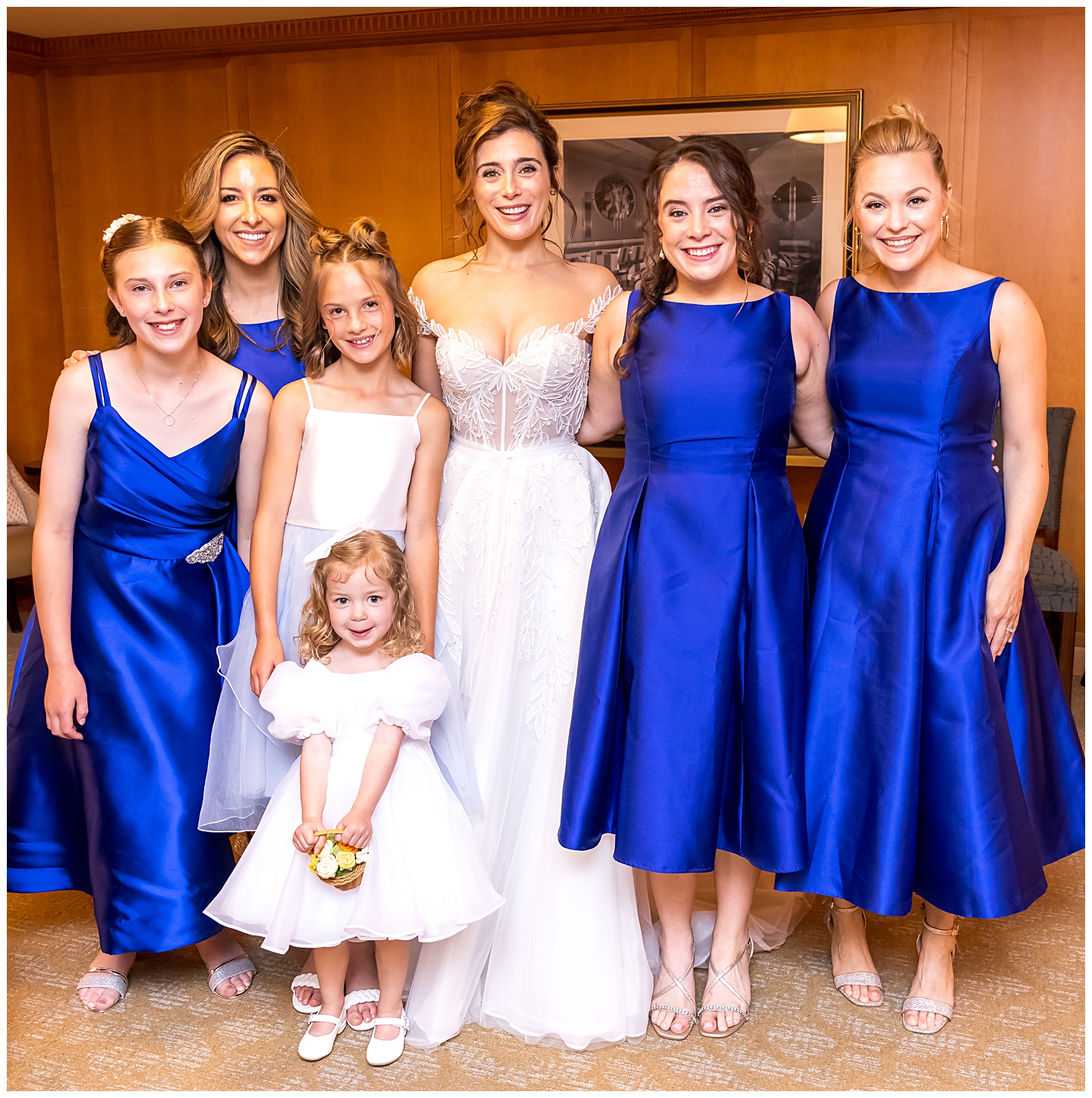 Bride with bridesmaids in cobalt blue dresses group photo before DC wedding ceremony