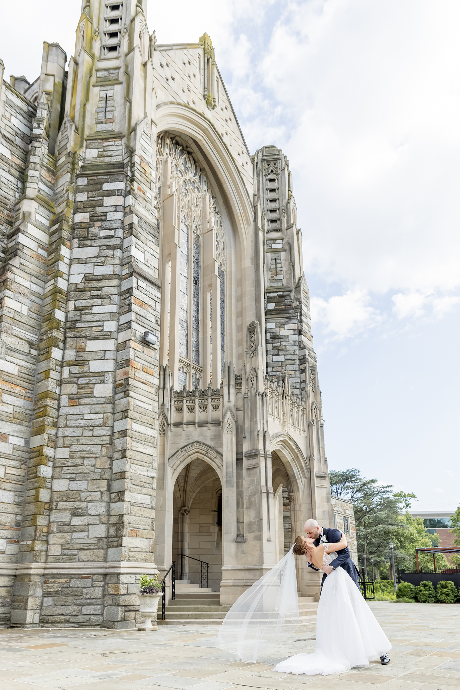 bride and groom portrait in front of historic church after wedding in washington dc