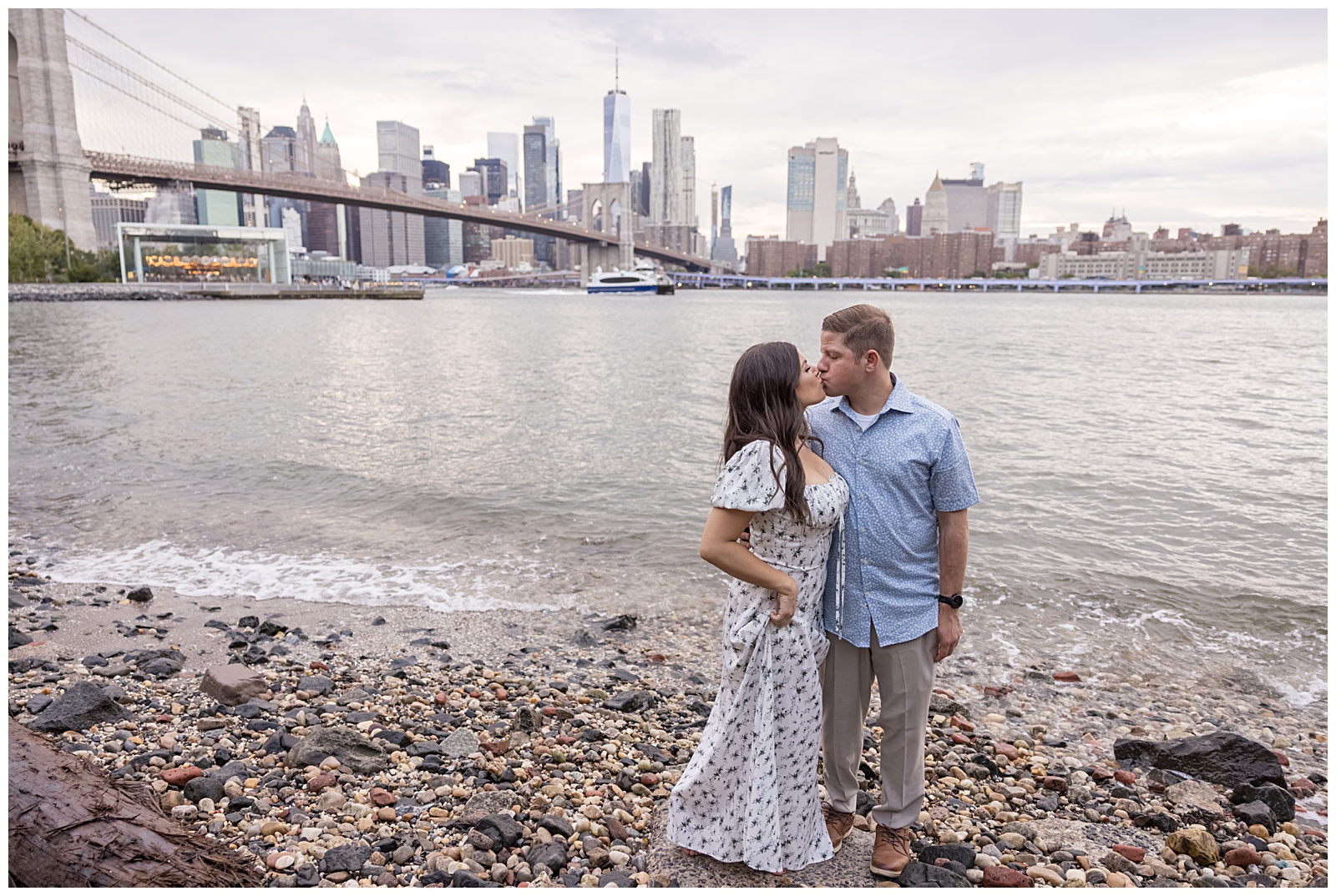Golden hour engagement photo of Stefanie and Brad at Pebble Beach, DUMBO.