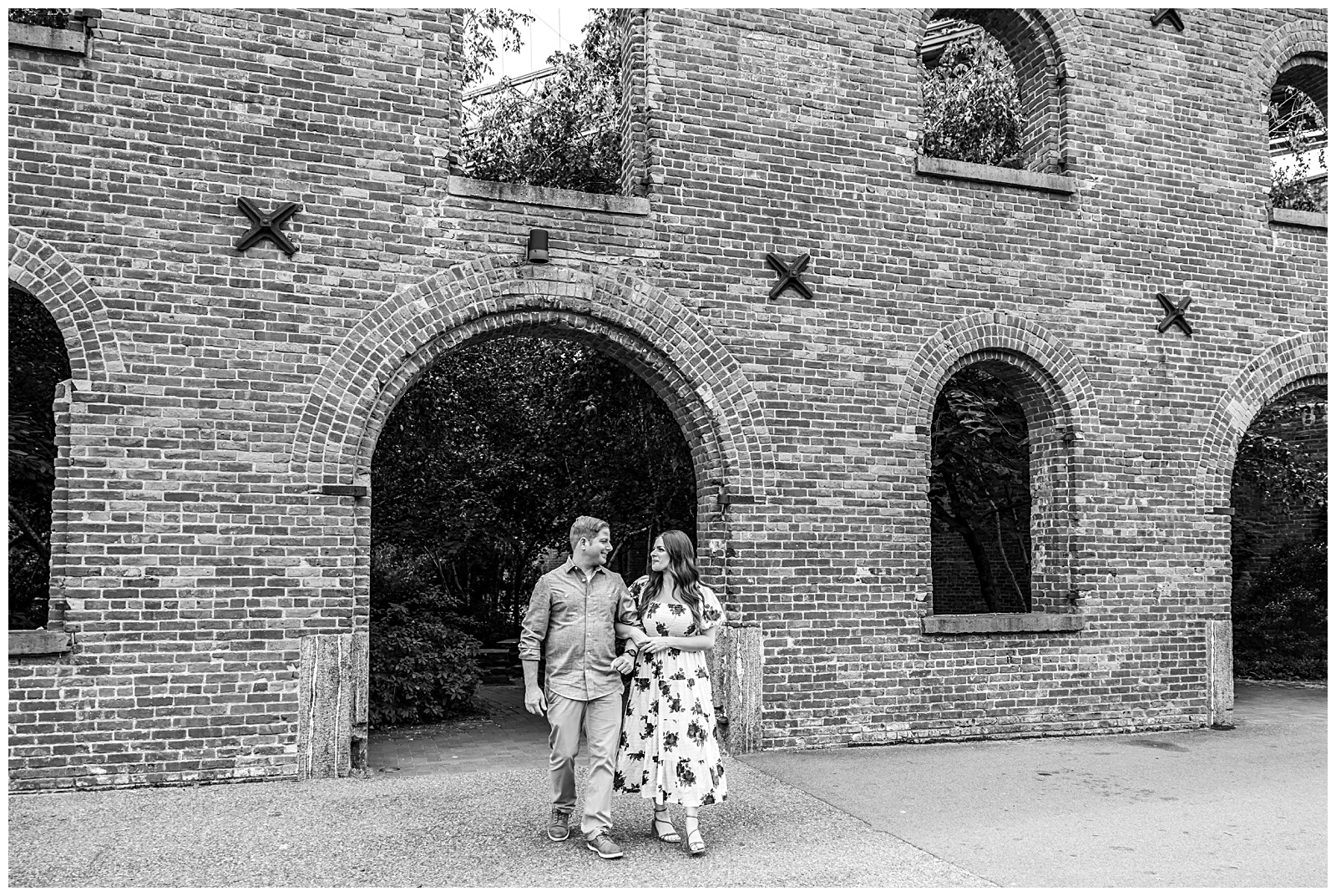Stefanie and Brad near Jane’s Carousel with Brooklyn Bridge in the background during their engagement session.