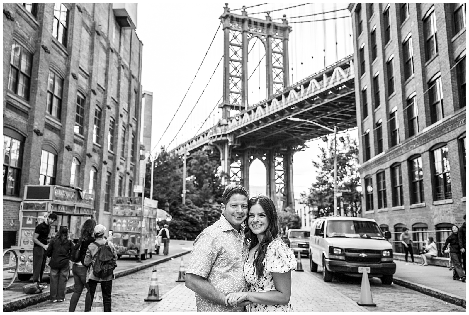Classic smiling engagement portrait of Stefanie and Brad on Washington Street in Brooklyn.