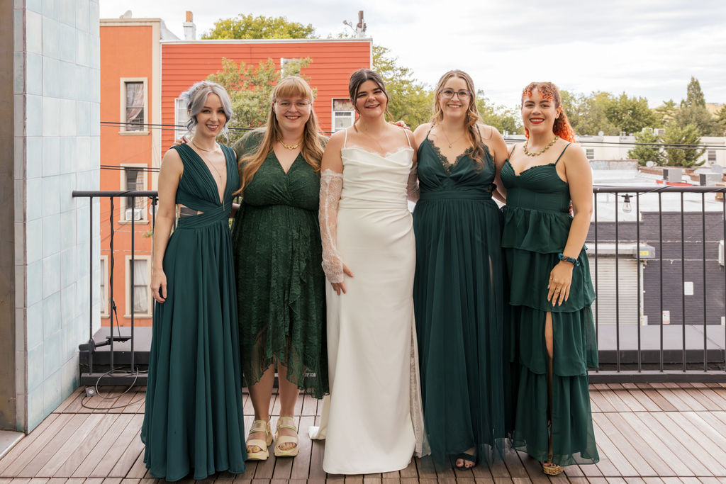 Wedding party portrait at a Brooklyn brewery wedding with a relaxed and inclusive atmosphere.