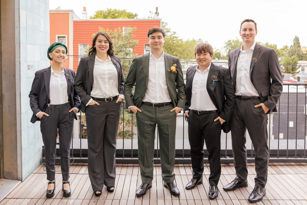 Wedding party portrait on a Brooklyn rooftop during an intimate non traditional wedding.