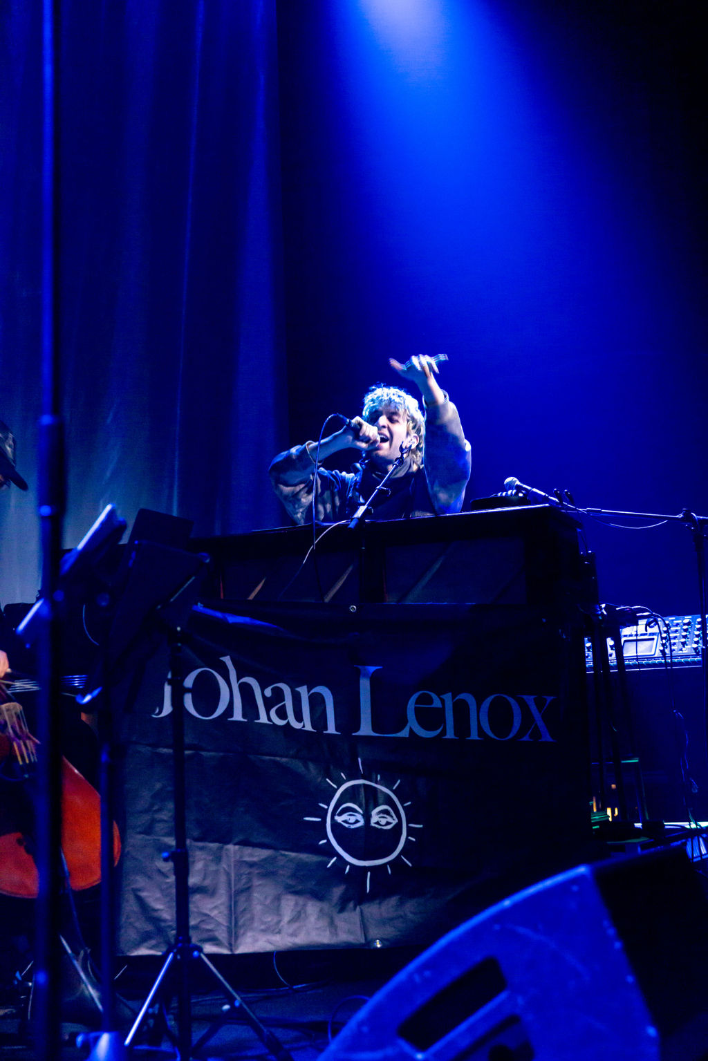 Close up of artist singing on stage at the 9:30 Club in Washington DC.