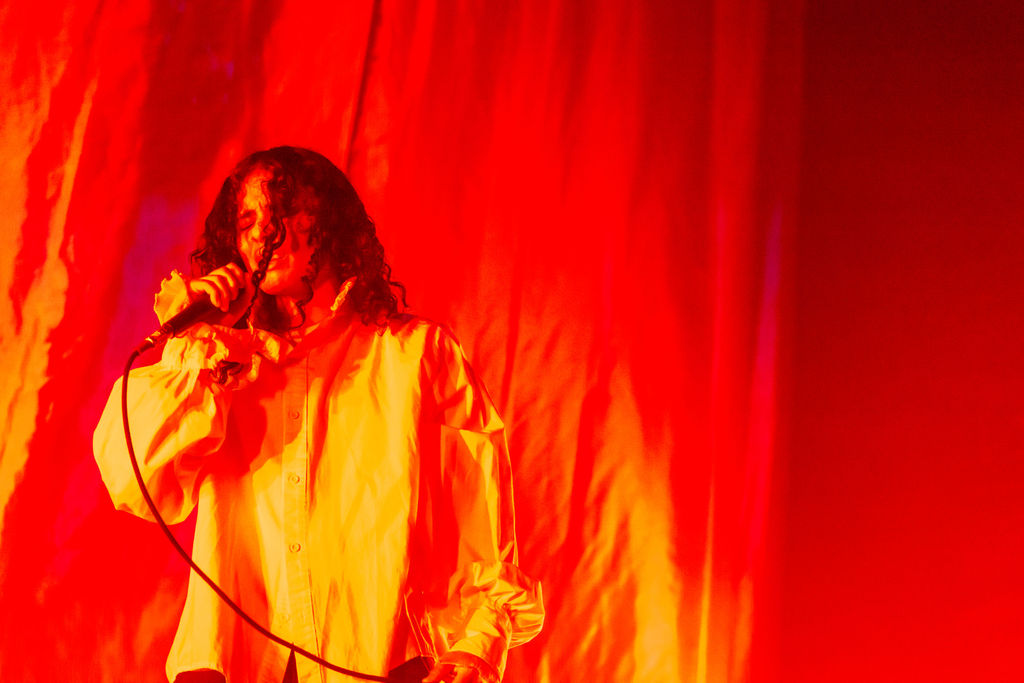070 Shake mid performance at the 9:30 Club with dramatic lighting and shadows.