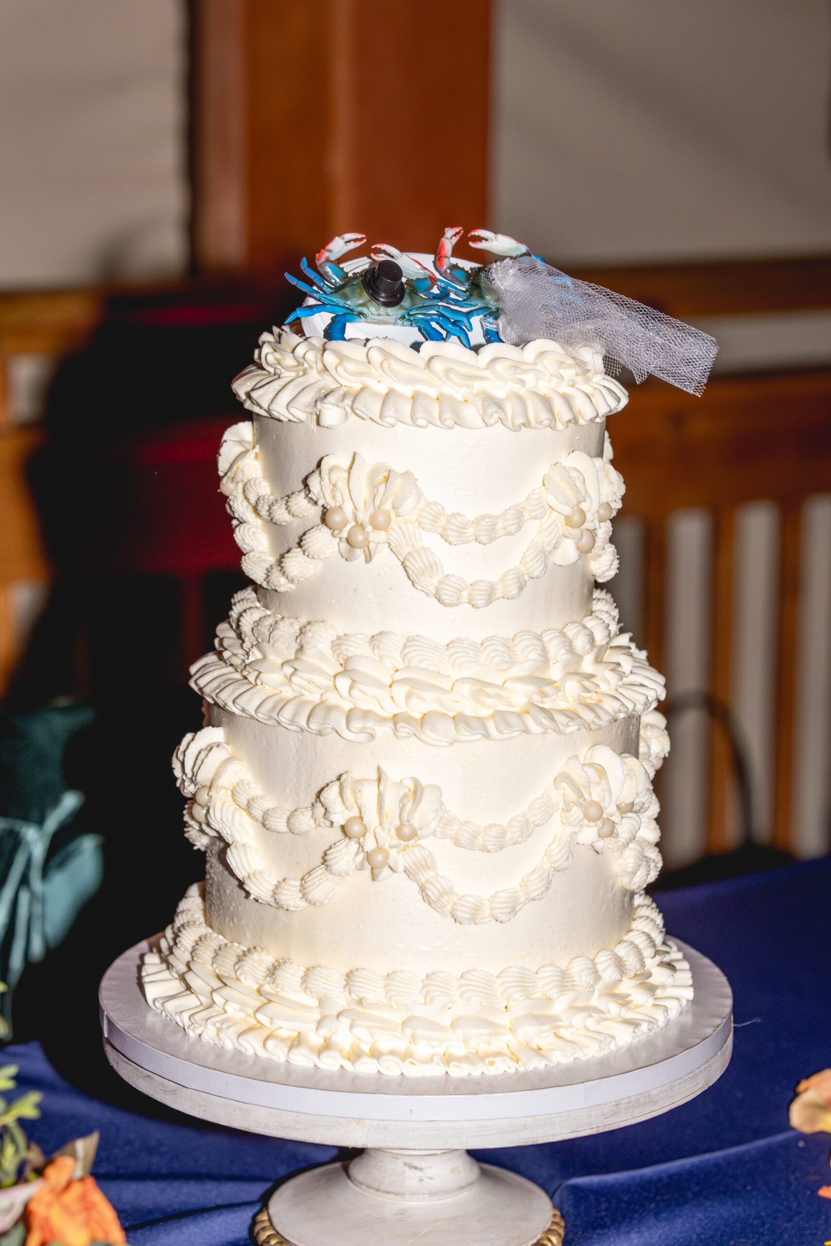 Wedding guests gathering outside brick building with heaters during fall cocktail hour in Annapolis, Maryland