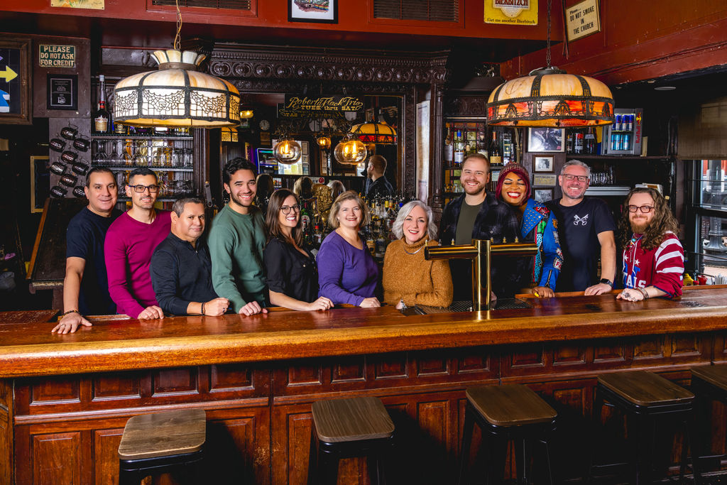 full team photo inside washington dc bar for commercial branding and marketing visuals