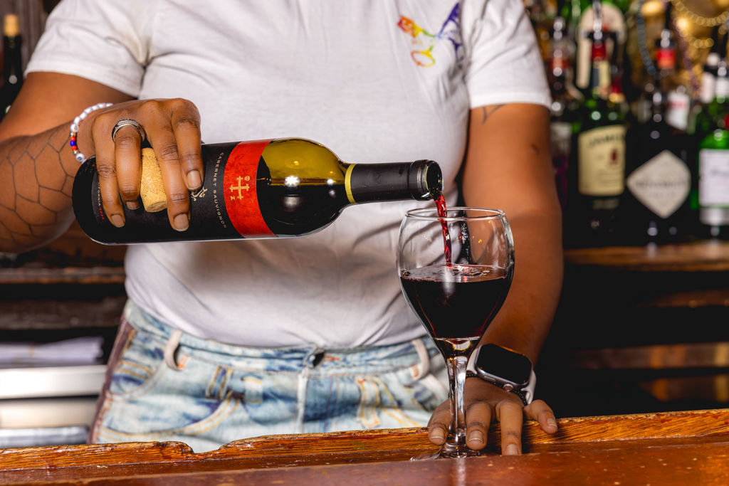 bartender pouring red wine at washington dc restaurant bar hospitality photography