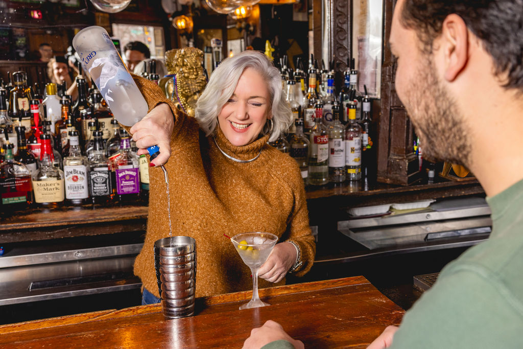 bartender crafting martini at mr henrys dc bar hospitality branding photography