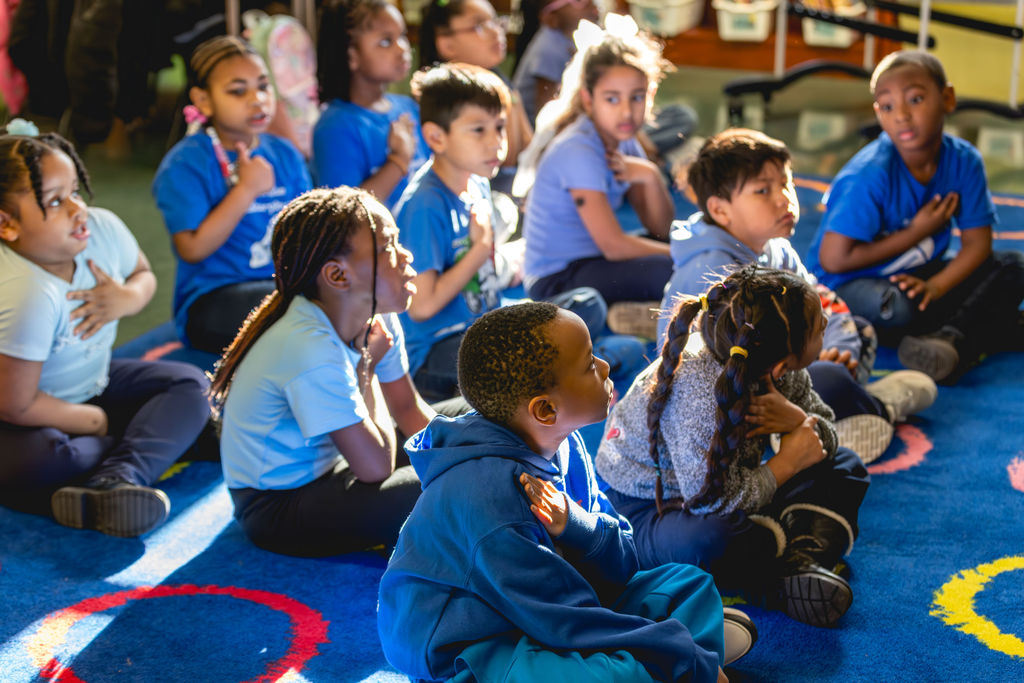Students sitting together during a classroom activity at P.S. 272 Curtis Estabrook after-school program in New York