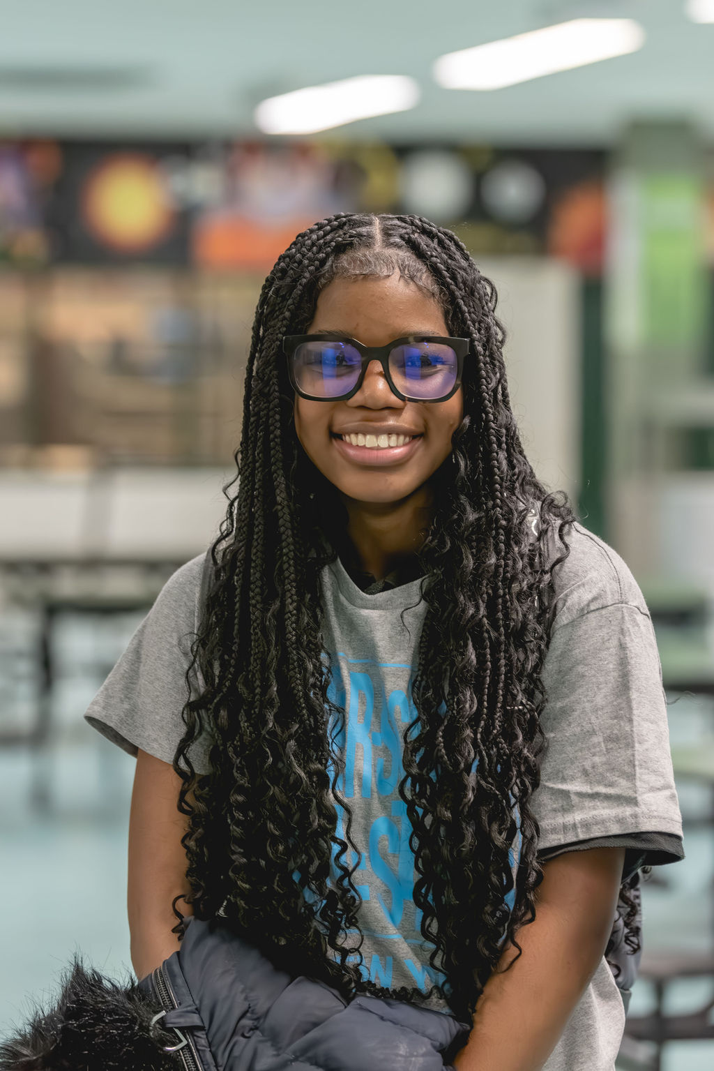 Documentary school photography portrait of smiling after-school student at Excel Upper School in New York