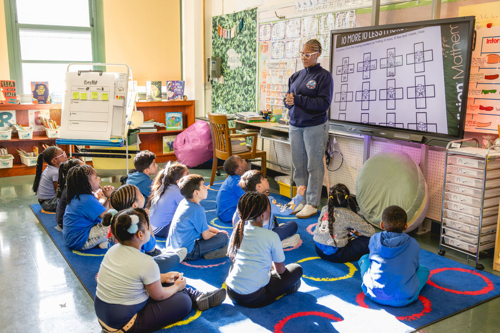 Teacher leading math lesson during after-school class at P.S. 272 Curtis Estabrook in New York