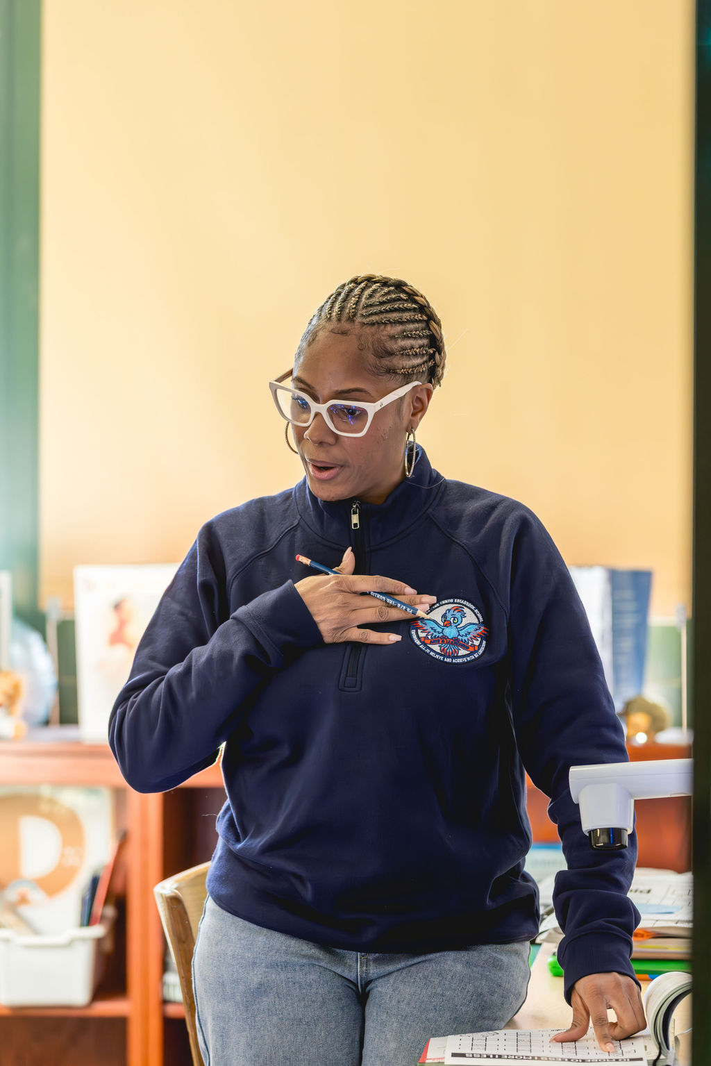 Educator speaking to students during classroom lesson at P.S. 272 Curtis Estabrook in Brooklyn