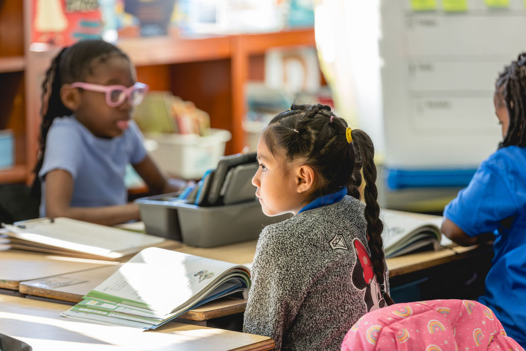 Student listening during classroom activity at P.S. 272 Curtis Estabrook after-school education program