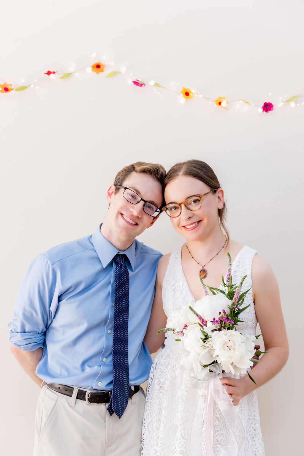 Bride and groom portrait by Washington DC wedding photographer at unique arts venue