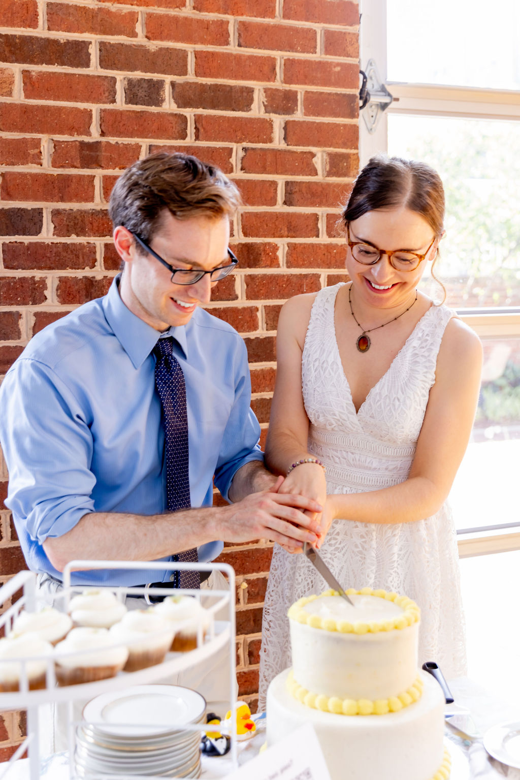 Couple cutting wedding cake during intimate Washington DC wedding celebration