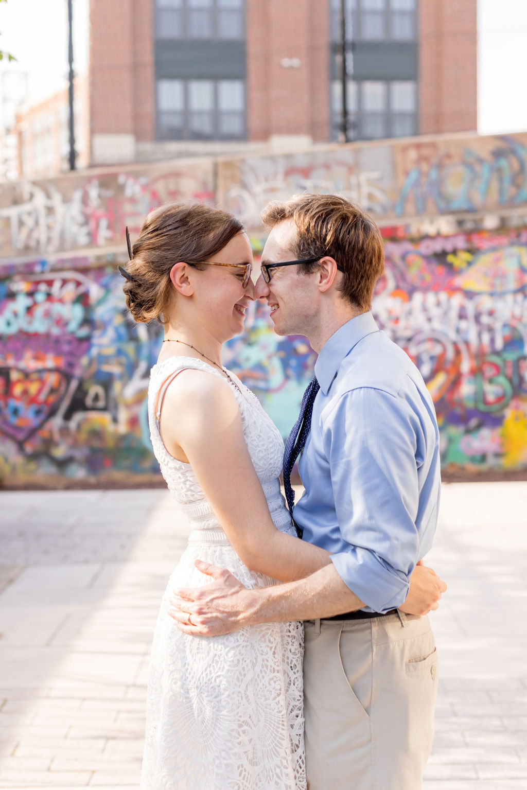 Bride and Groom in each other's embrace at the edgewood arts center