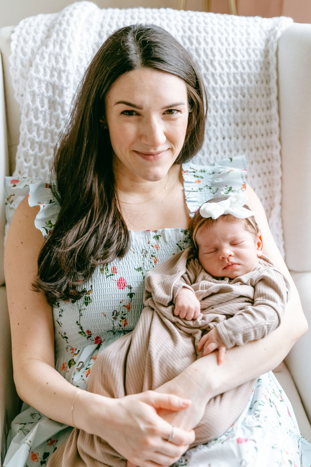 Mother holding her newborn during an intimate in-home newborn session in Washington DC