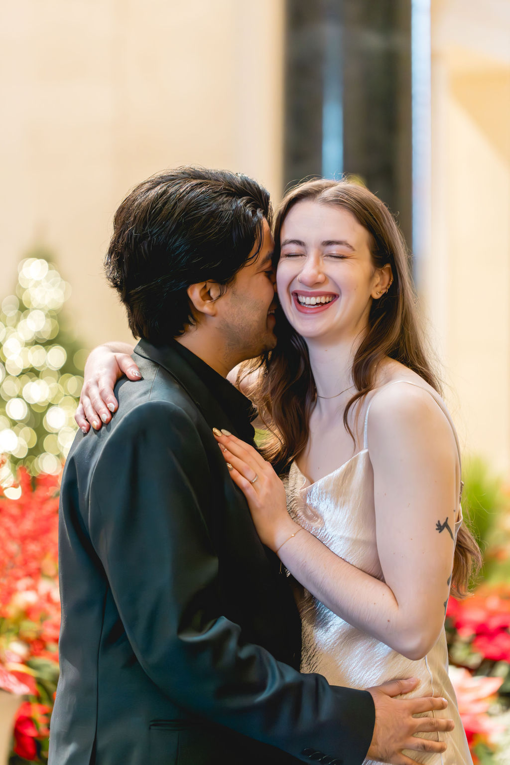 Candid photo of a couple laughing together at the National Gallery of Art in Washington DC a prime photoshoot location indoors